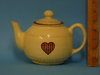 Teapot with cream and red decoration